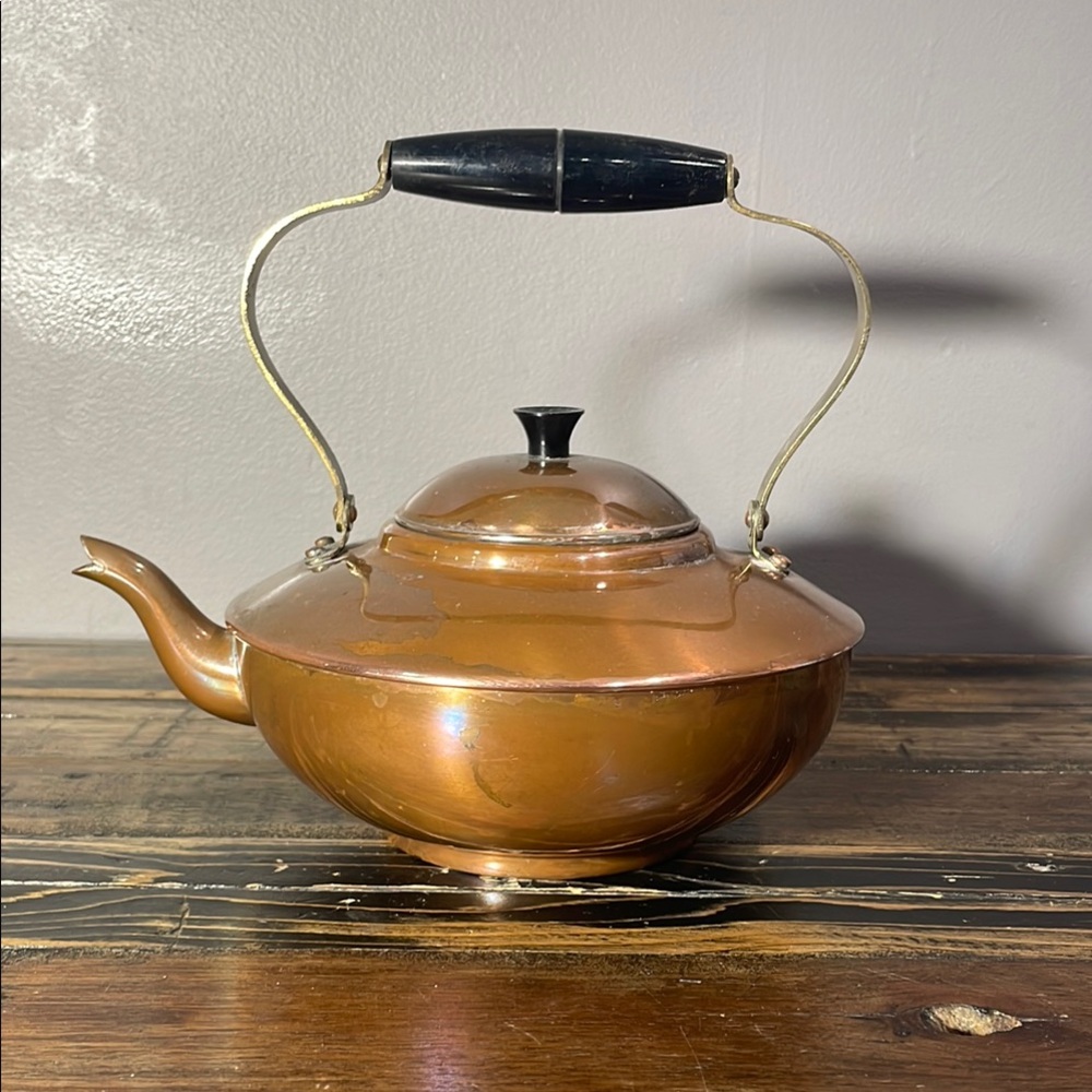 Made in Portugal copper teapot - gorgeous patina.  Brass metal & black handle